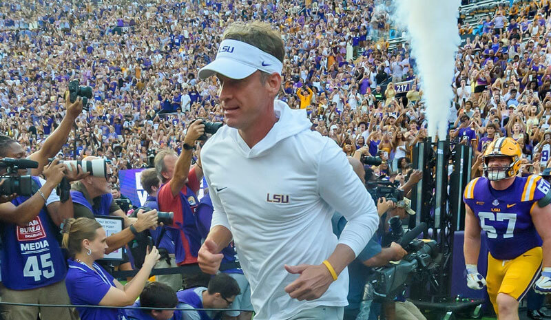 LSU head coach Lane Kiffin takes the field before his team's game against Louisiana Tech.