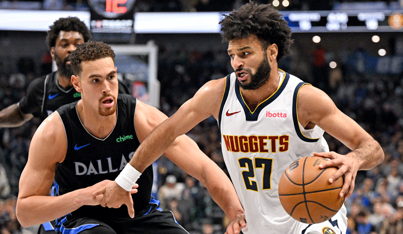 Jamal Murray (27) brings the ball up court past Dallas Mavericks forward Dwight Powell (7) during the first quarter at the American Airlines Center.