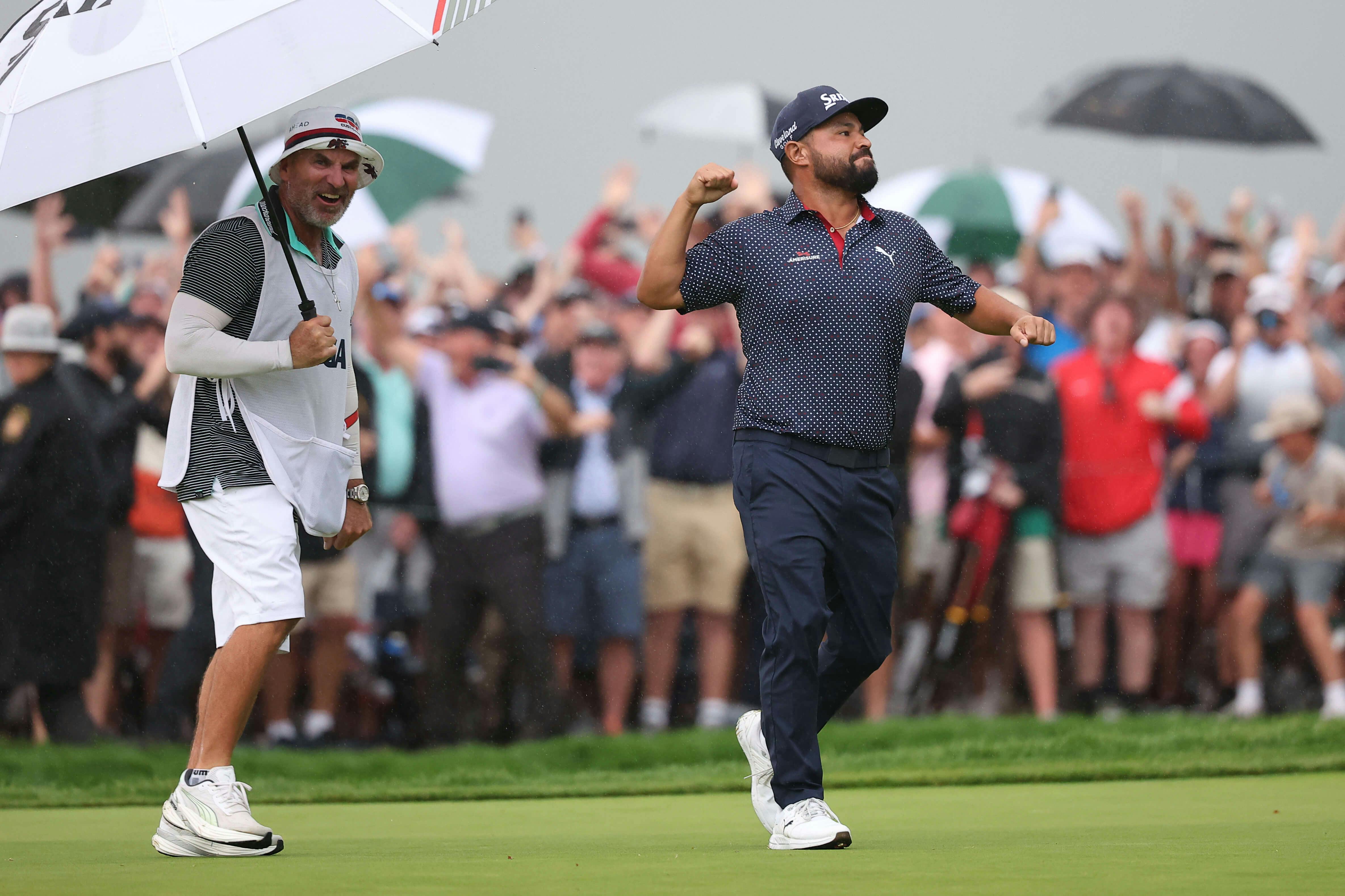 JJ Spaun celebrates after putting on the 18th green to win during the final round of the U.S. Open golf tournament. Bill Streicher-Imagn Images
