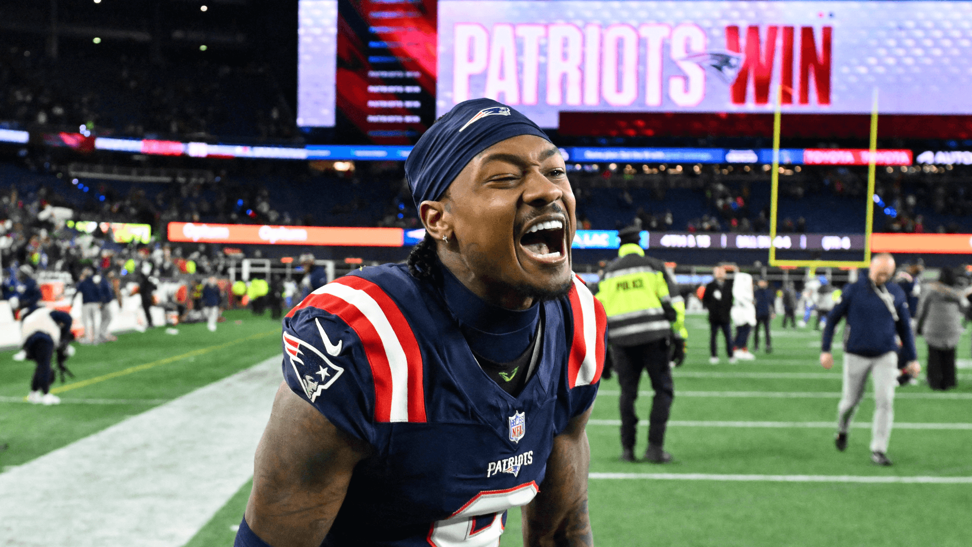 New England Patriots wide receiver Stefon Diggs (8) reacts after defeating the Los Angeles Chargers in an AFC Wild Card Round game at Gillette Stadium.