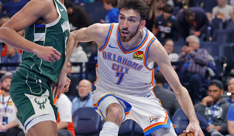 Chet Holmgren (7) drives to the basket as Milwaukee Bucks forward Ousmane Dieng (21) defends during the second half at Paycom Center.