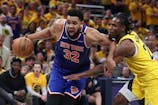 New York Knicks center Karl-Anthony Towns (32) drives to the basket against Indiana Pacers guard Andrew Nembhard (2) in the third quarter during Game 6 of the Eastern Conference Finals. Trevor Ruszkowski-Imagn Images