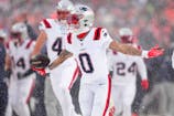 New England Patriots cornerback Christian Gonzalez (0) reacts after an interception against the Denver Broncos during the second half in the 2026 AFC Championship Game at Empower Field at Mile High. Ron Chenoy-Imagn Images