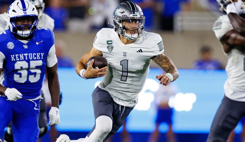 Eastern Michigan Eagles quarterback Noah Kim (1) runs the ball.
