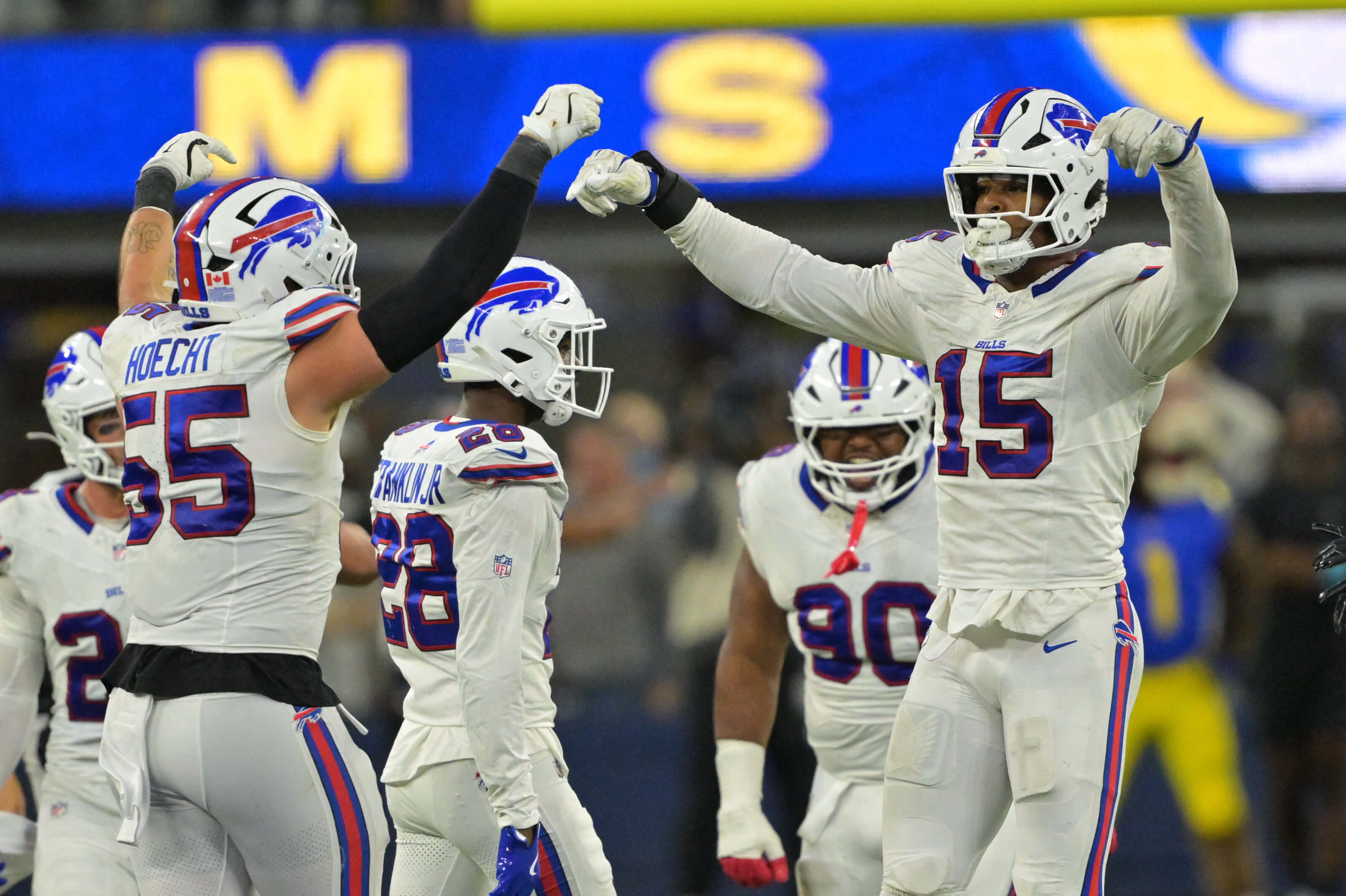 NFL AI predictions, Buffalo Bills linebacker Greg Rousseau (15) celebrates with Buffalo Bills defensive end Michael Hoecht (55) after blocking a field goal.