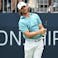 Tommy Fleetwood watches his tee shot on the first hole during the third round.