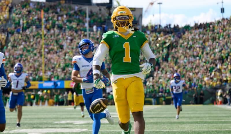 Oregon Ducks wide receiver Dakorien Moore (1) scores a touchdown.