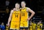 Iowa Hawkeyes guard Carter Kingsbury (14) and Iowa Hawkeyes forward Payton Sandfort (20) stand together as free throws are shot against the Washington Huskies Saturday, Feb. 22, 2025 at Carver-Hawkeye Arenain Iowa City, Iowa