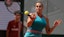 Aryna Sabalenka returns a shot during her match against Qinwen Zheng.