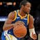 Golden State Warriors forward Jonathan Kuminga (1) dribbles the ball next to Memphis Grizzlies center Jock Landale (31) in the fourth quarter at the Chase Center.