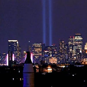 Sep 11, 2020; Flushing Meadows, New York, USA; The 9/11 Tribute of Lights rise above New York City skyline honoring the victims from 19 years ago.