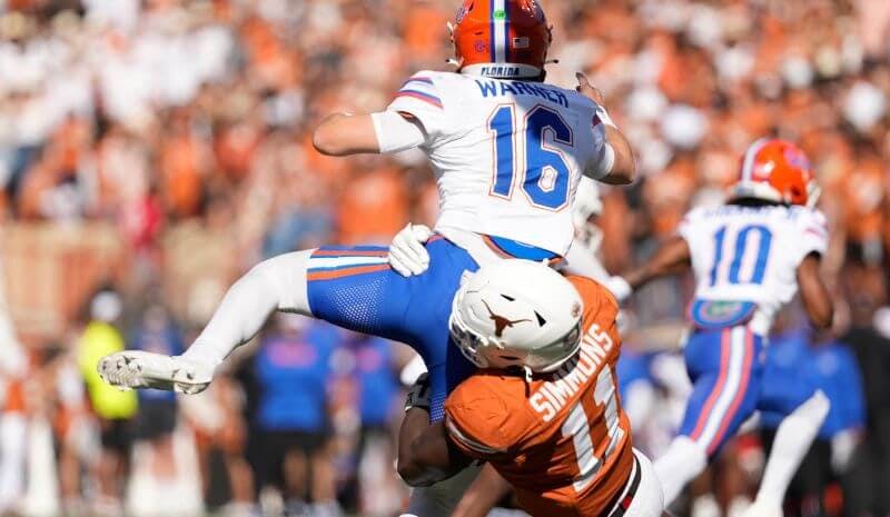 Florida Gators quarterback Aidan Warner (16) gets sacked. 