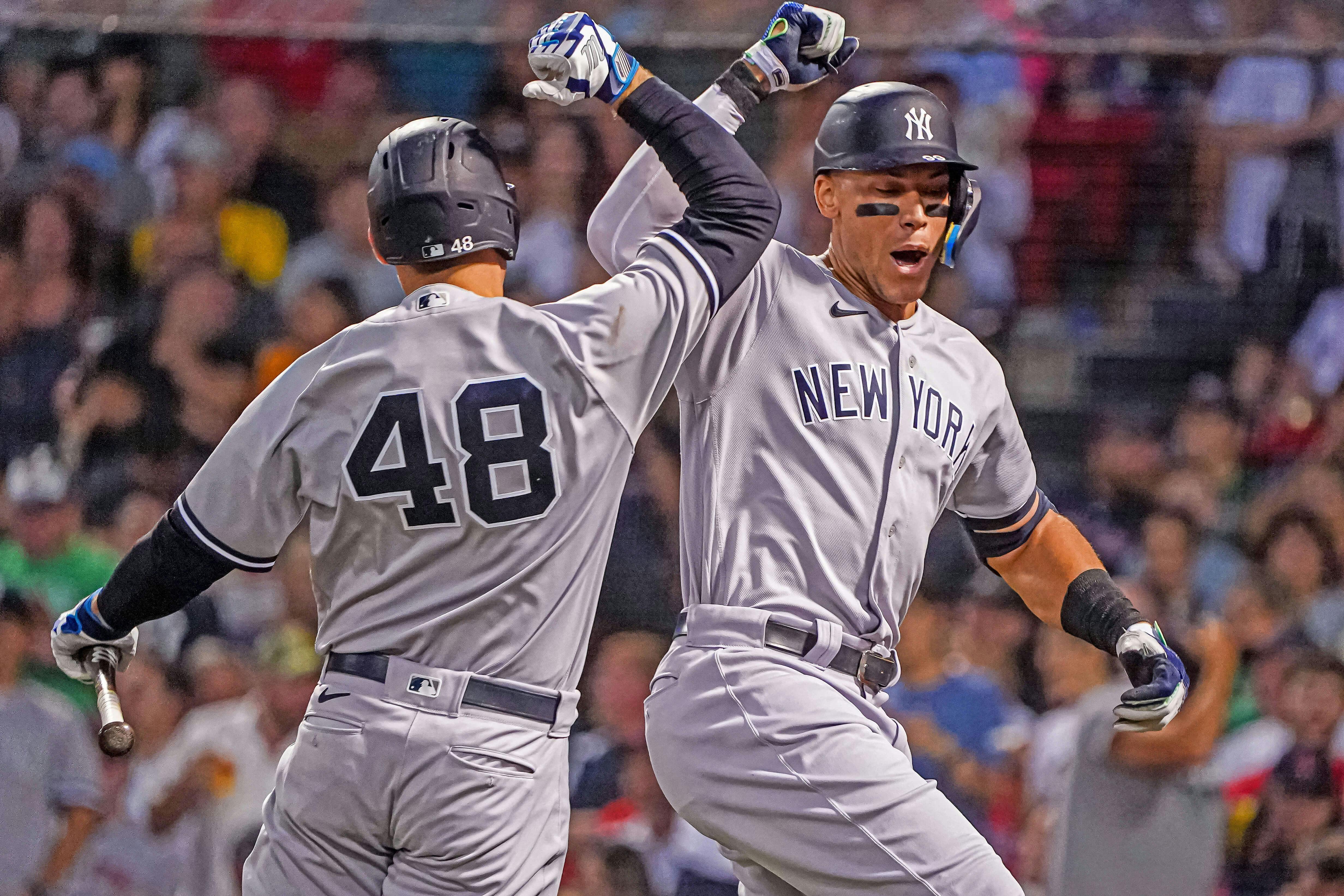 New York Yankees Anthony Rizzo and Aaron Judge celebrate during MLB action.