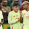 Spain's Nico Williams (l-r), Pedri and Lamine Yamal speak on the pitch.