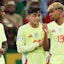 Spain's Nico Williams (l-r), Pedri and Lamine Yamal speak on the pitch.