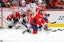 ew York Rangers defenseman Jacob Trouba (8) shoots the puck as Washington Capitals right wing Tom Wilson (43) defends during the first period at Capital One Arena.