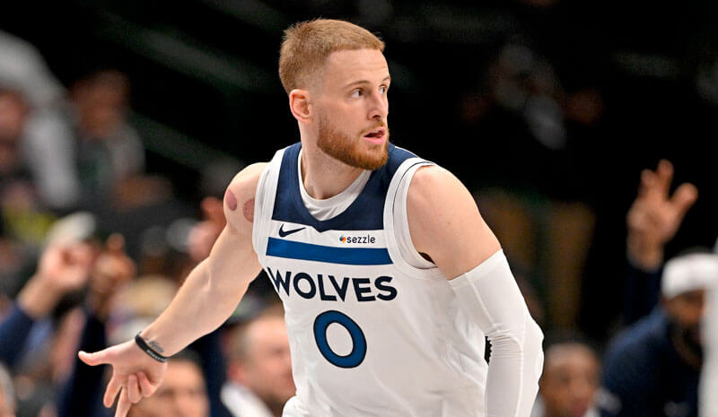 Minnesota Timberwolves guard Donte DiVincenzo (0).