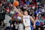 Florida Gators guard Walter Clayton Jr. (1) and Connecticut Huskies guard Hassan Diarra (10) battle for the ball during the first half in the second round of the NCAA Tournament at Lenovo Center. Mandatory Credit: Bob Donnan-Imagn Images