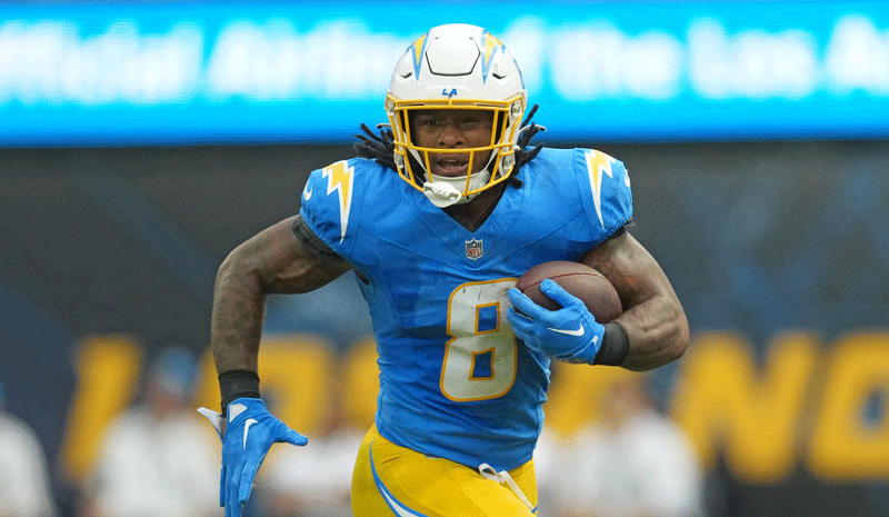Los Angeles Chargers running back Omarion Hampton (8) carries the ball.