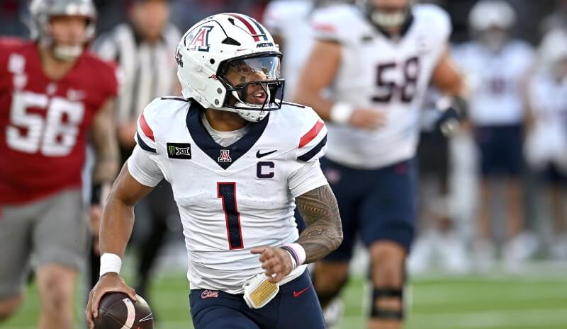 Arizona Wildcats quarterback Noah Fifita (1) carries the ball.