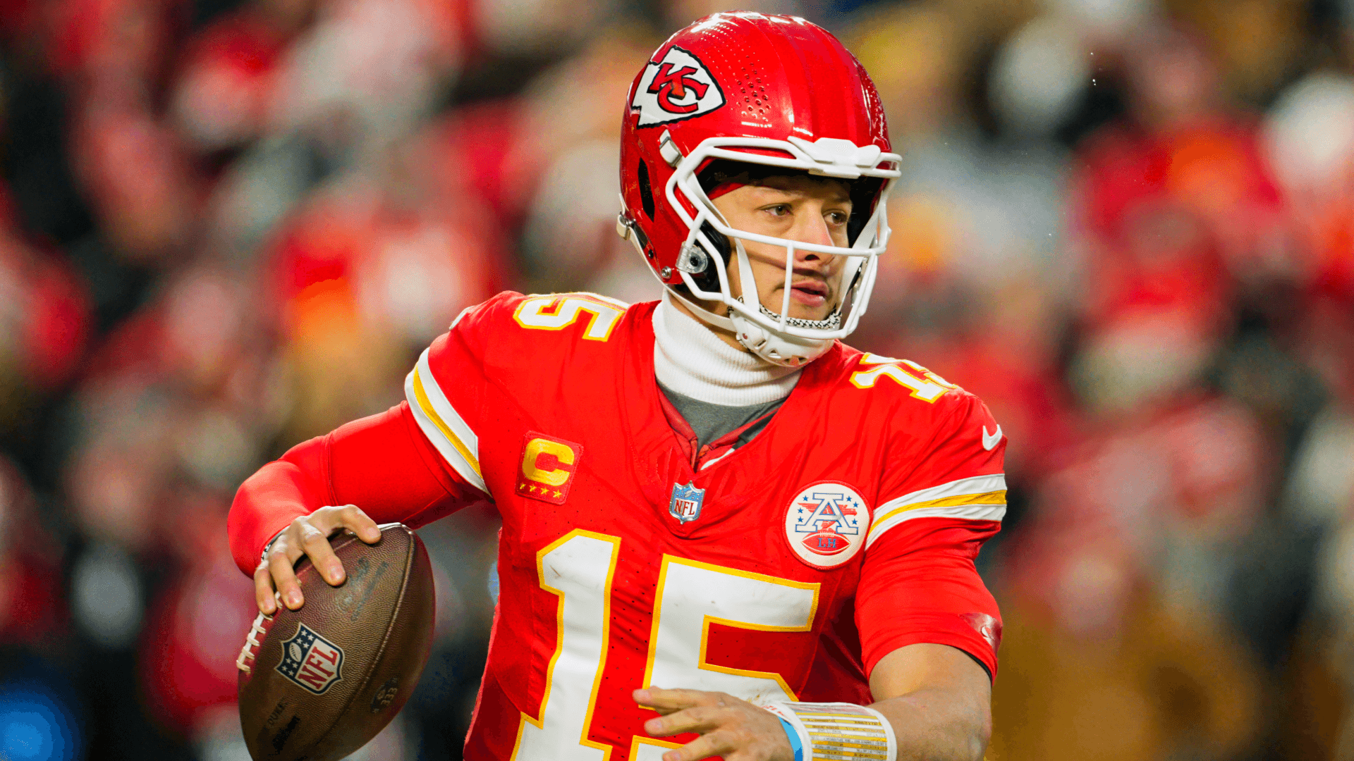 Kansas City Chiefs quarterback Patrick Mahomes (15) rolls out to pass.