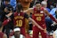 Cleveland Cavaliers guard Darius Garland (10) and guard Donovan Mitchell (45) celebrate a win over the Boston Celtics at Rocket Mortgage FieldHouse. Mandatory Credit: David Richard-Imagn Images