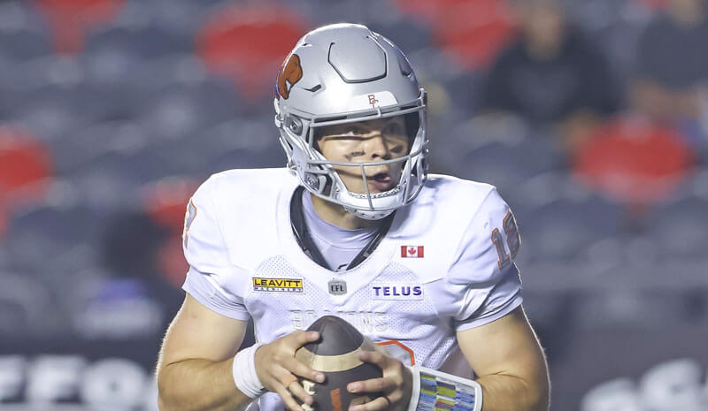 BC Lions quarterback Nathan Rourke (12) runs and looks downfield.