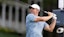 Rory McIlroy plays his shot from the 18th tee during the third round of the Travelers Championship.