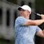 Rory McIlroy plays his shot from the 18th tee during the third round of the Travelers Championship.