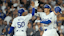 Los Angeles Dodgers designated hitter Shohei Ohtani (17) celebrates at home plate with shortstop Mookie Betts (50).