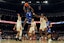 New Orleans Privateers guard Jah Short (2) drives to the basket past Texas Longhorns guard Jordan Pope (0) and forward Ze'Rik Onyema (21) during the first half at Moody Center. Mandatory Credit: Scott Wachter-Imagn Images