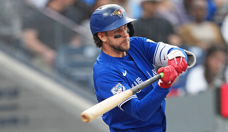 Ernie Clement (22) hits a home run against the Miami Marlins.