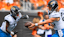 Jacksonville Jaguars quarterback Trevor Lawrence (16) hands the ball off to running back Travis Etienne Jr. (1) in the first half against the Cincinnati Bengals at Paycor Stadium.
