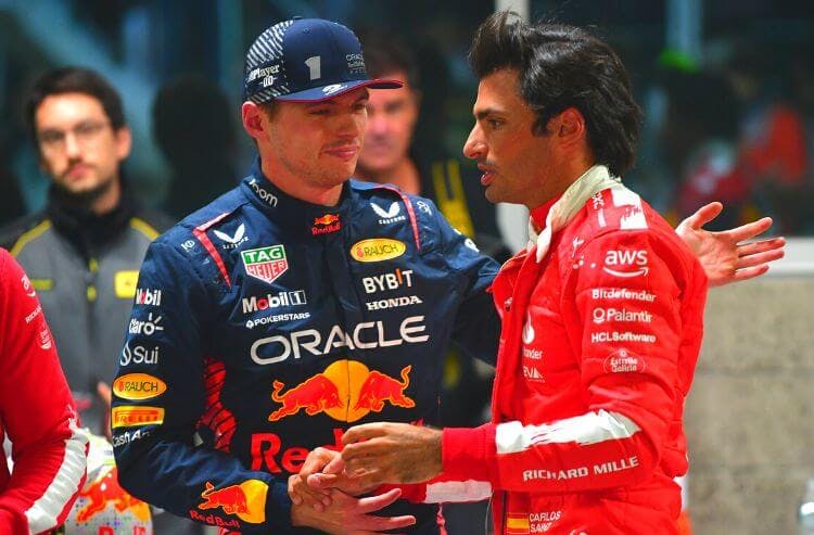 Red Bull Racing driver Max Verstappen of The Netherlands (1) greets Scuderia Ferrari driver Carlos Sainz Jr. of Spain