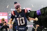 New England Patriots quarterback Drake Maye (10) high fives the Massachusetts after defeating the Houston Texans in the AFC divisional playoff game. Eric Canha/CSM/Sipa USA
