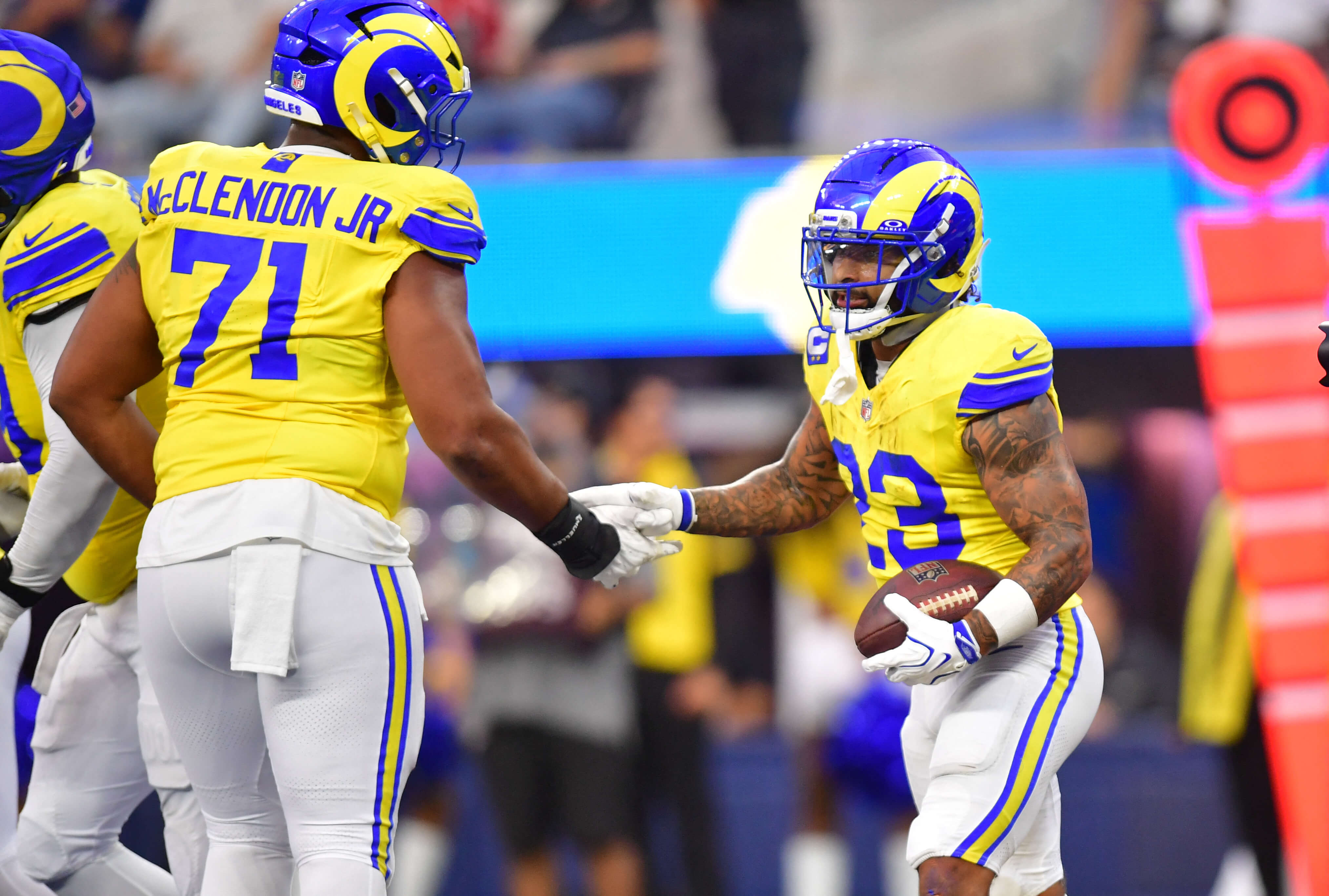 Rams vs Broncos AI predictions SNF, Los Angeles Rams running back Kyren Williams (23) celebrates with Los Angeles Rams offensive line Warren McClendon Jr. (71).
