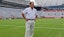 Coach Nick Saban stands on the turf inside Bryant-Denny Stadium during media day.