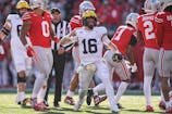 Michigan quarterback Davis Warren (16) celebrates a first down against Ohio State during the second half at Ohio Stadium in Columbus, Ohio on Saturday, Nov. 30, 2024.