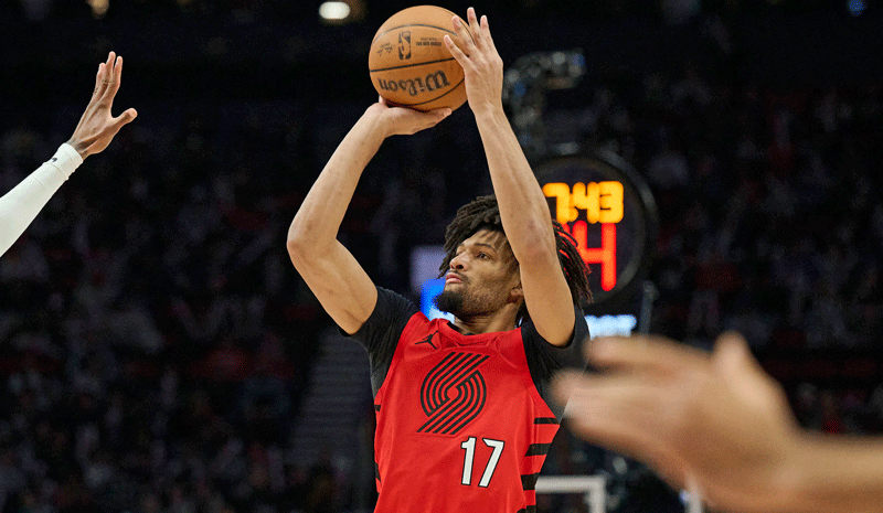 Portland Trail Blazers guard Shaedon Sharpe (17) shoots a jump shot during the second half against Houston Rockets forward Jabari Smith Jr. (10) at Moda Center.
