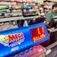 Harry Patel at Power Trac 9 gas station and convenience store at the register, near a display for the Mega Million South Carolina Education Lottery, on 2804 U.S. 29 South in Anderson December 26, 2024.
