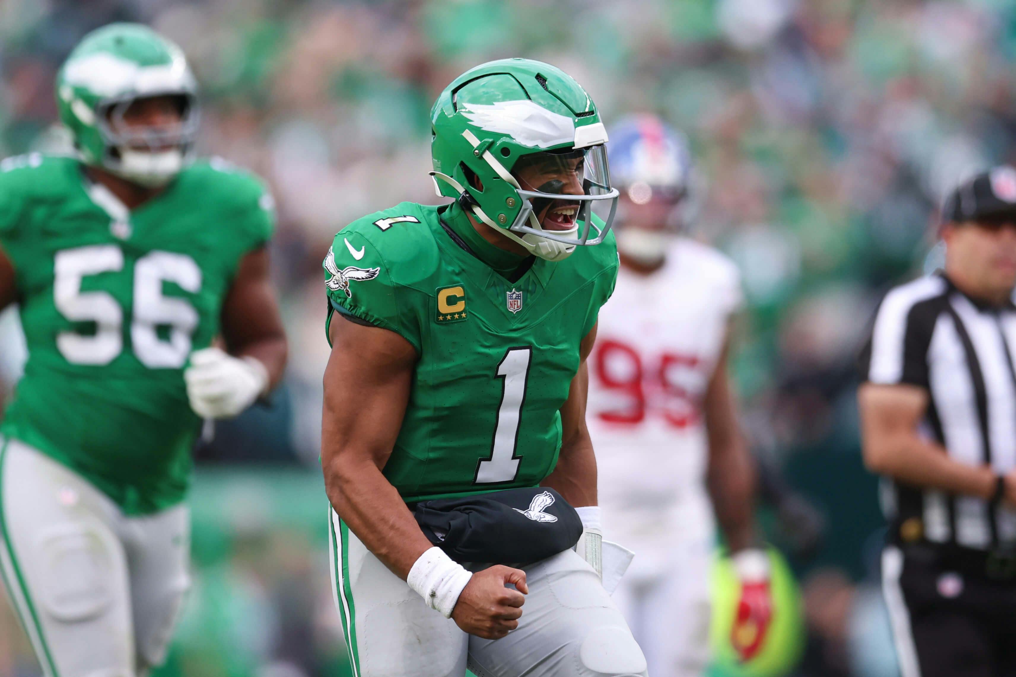 Philadelphia Eagles quarterback Jalen Hurts (1) reacts after his touchdown pass against the New York Giants during the fourth quarter at Lincoln Financial Field. Bill Streicher-Imagn Images