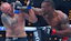 Jailton Almeida (red gloves) fights Serghei Spivac (blue gloves) during UFC 311 at Intuit Dome.