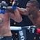 Jailton Almeida (red gloves) fights Serghei Spivac (blue gloves) during UFC 311 at Intuit Dome.