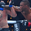 Jailton Almeida (red gloves) fights Serghei Spivac (blue gloves) during UFC 311 at Intuit Dome.