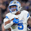 Detroit Lions berlari kembali David Montgomery (5) berlari melawan Baltimore Ravens.