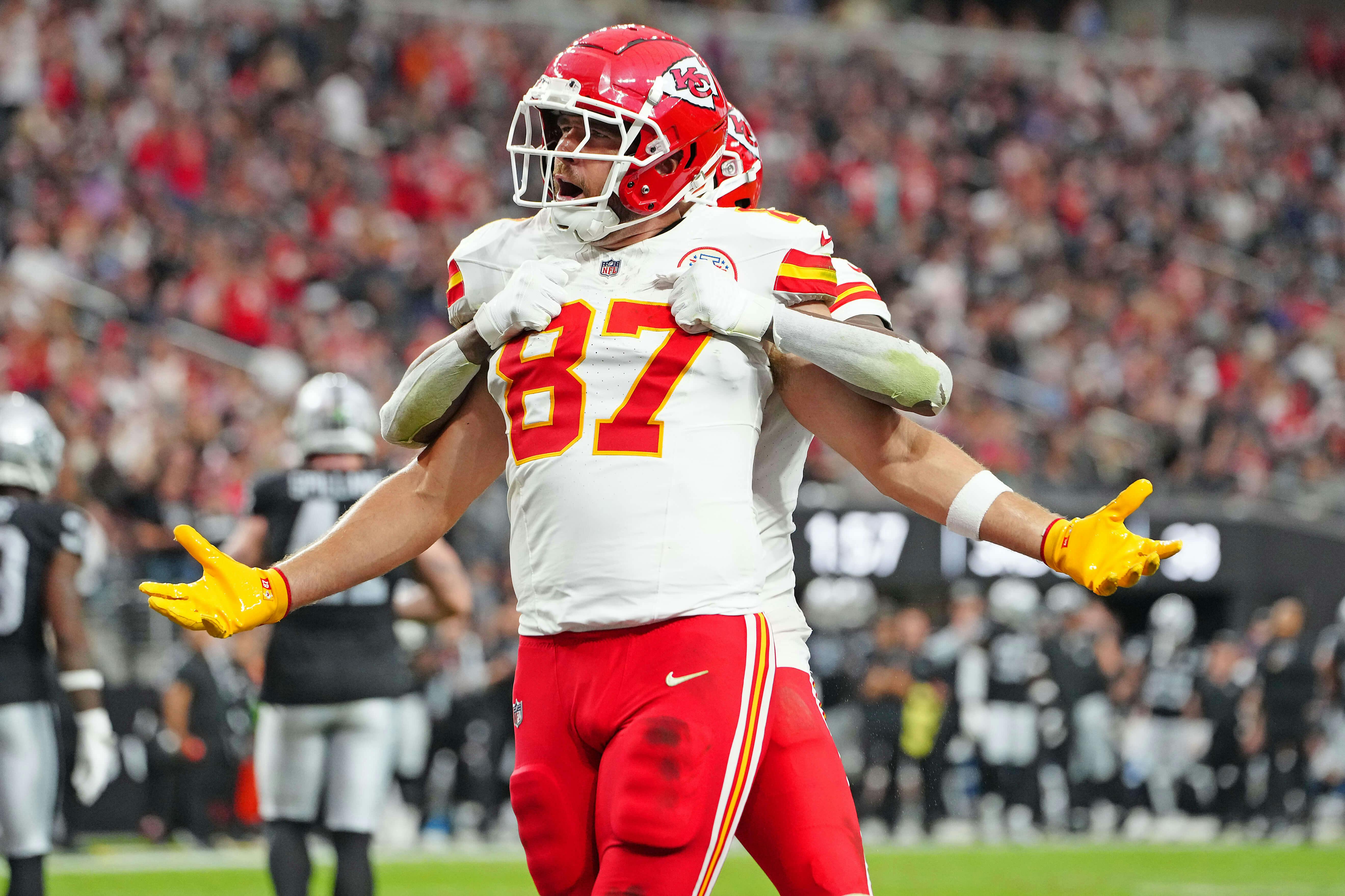 Kansas City Chiefs tight end Travis Kelce (87) celebrates with wide receiver DeAndre Hopkins (8) after scoring a touchdown against the Las Vegas Raiders during the second quarter at Allegiant Stadium. Mandatory Credit: Stephen R. Sylvanie-Imagn Images