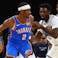 Oklahoma City Thunder guard Shai Gilgeous-Alexander (2) dribbles as Memphis Grizzlies guard Vince Williams Jr. (5) defends.