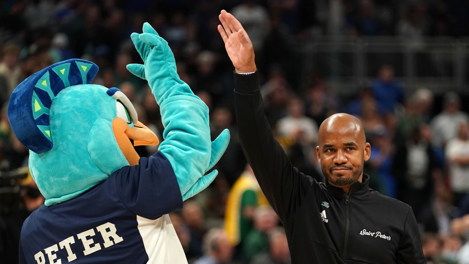 Saint Peter's Peacocks head coach Shaheen Hollway reacts after defeating the Kentucky Wildcats during the first round of the 2022 NCAA Tournament.