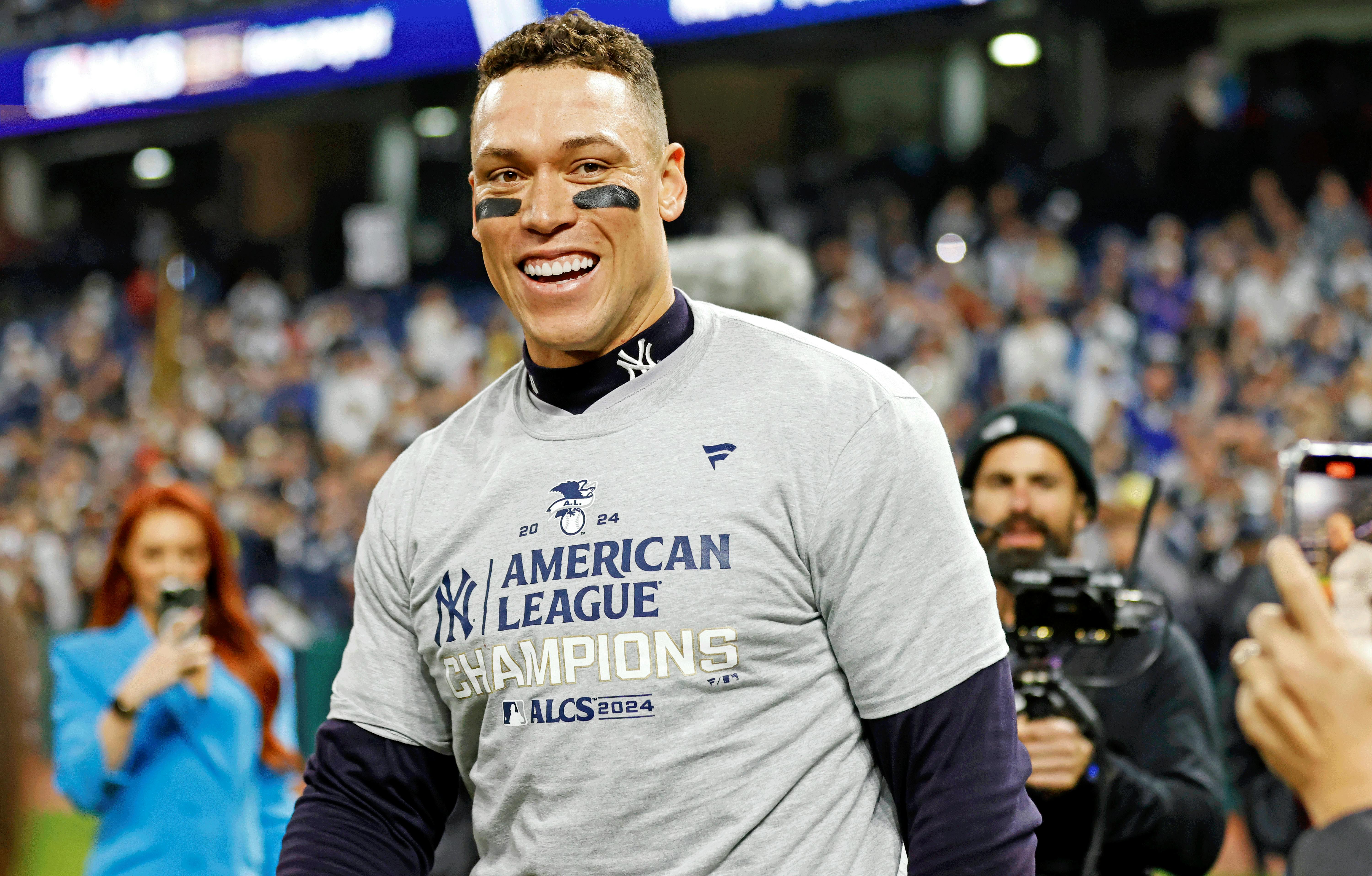 New York Yankees outfielder Aaron Judge (99) celebrates after beating the Cleveland Guardians during game five of the ALCS for the 2024 MLB playoffs at Progressive Field. Mandatory Credit: Scott Galvin-Imagn Images