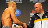 Georges St-Pierre shakes the hand of Dana White during the weigh-in for UFC 154.